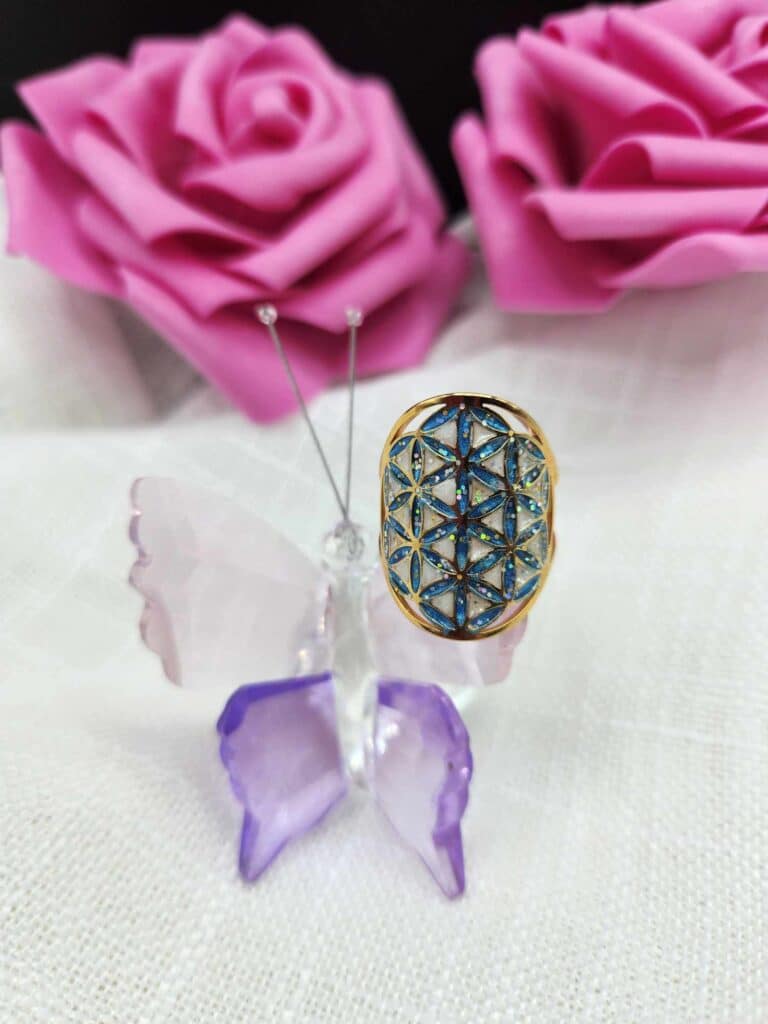 bague fleur de vie dorée éclat divin pailleté bleu et blanc Jewels Spirit sur papillon cristal
